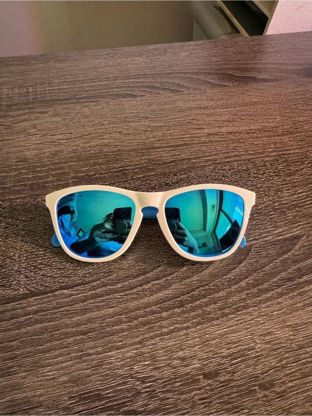 Oakley White Frame Sunglasses with Blue Mirrored Lenses